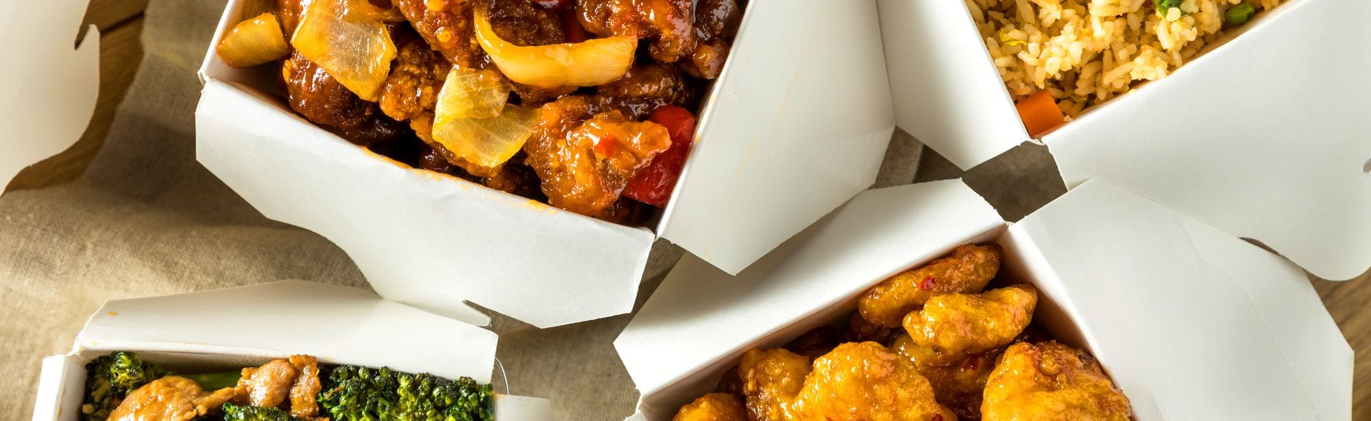 Spicy Chinese Take Out Food with Chopsticks and Fortune Cookies