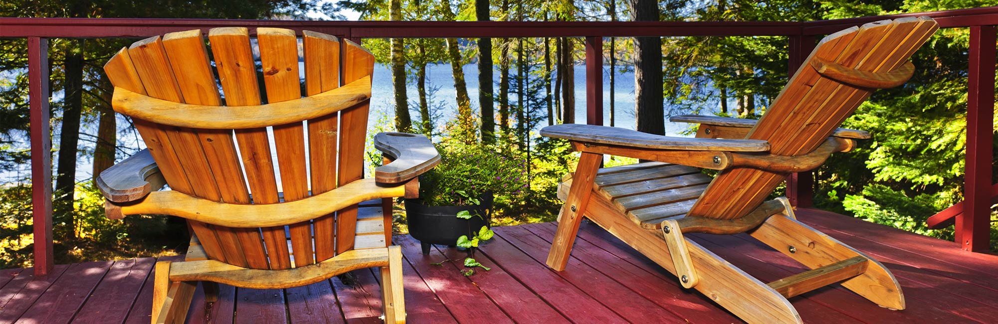Lawn chairs on deck overlooking lake
