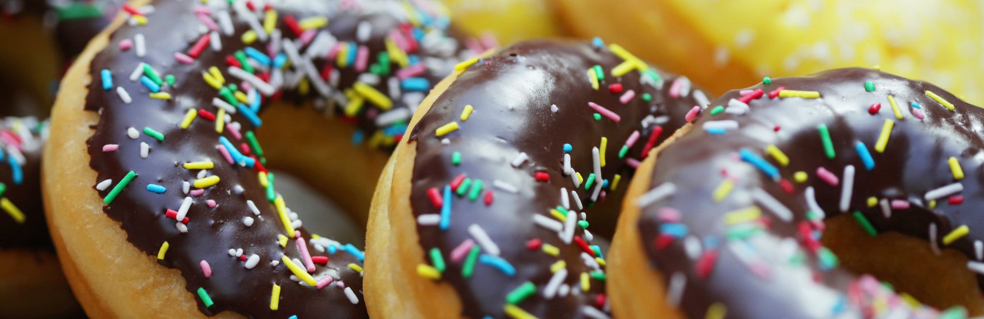 Close up of a selection of colorful donuts