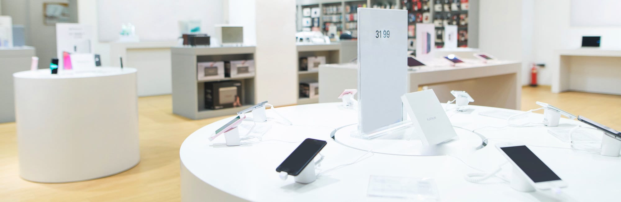 Showcase with smartphones in the background of technology store.