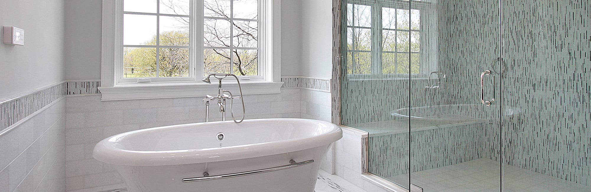 Master bath in new construction home with large glass shower